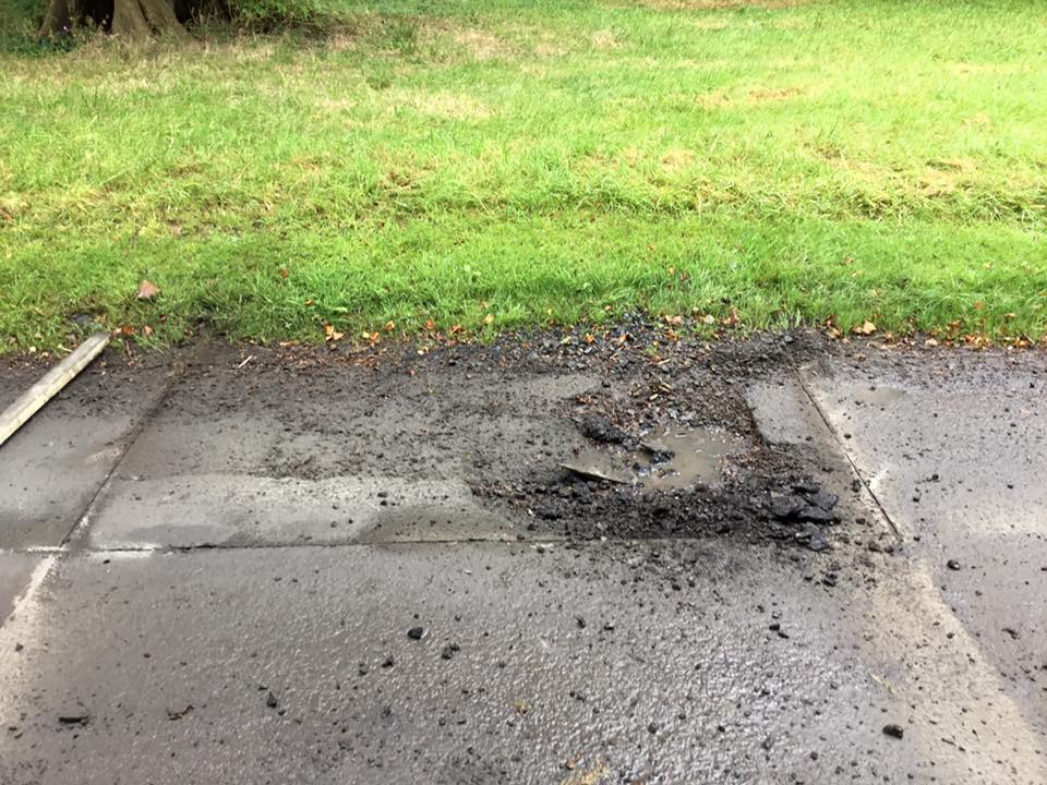 Resurfacing pot hole road repair works