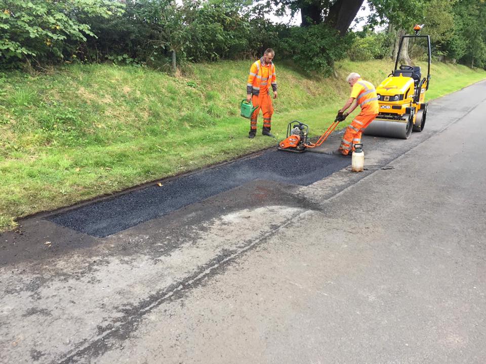 Resurfacing road repair works