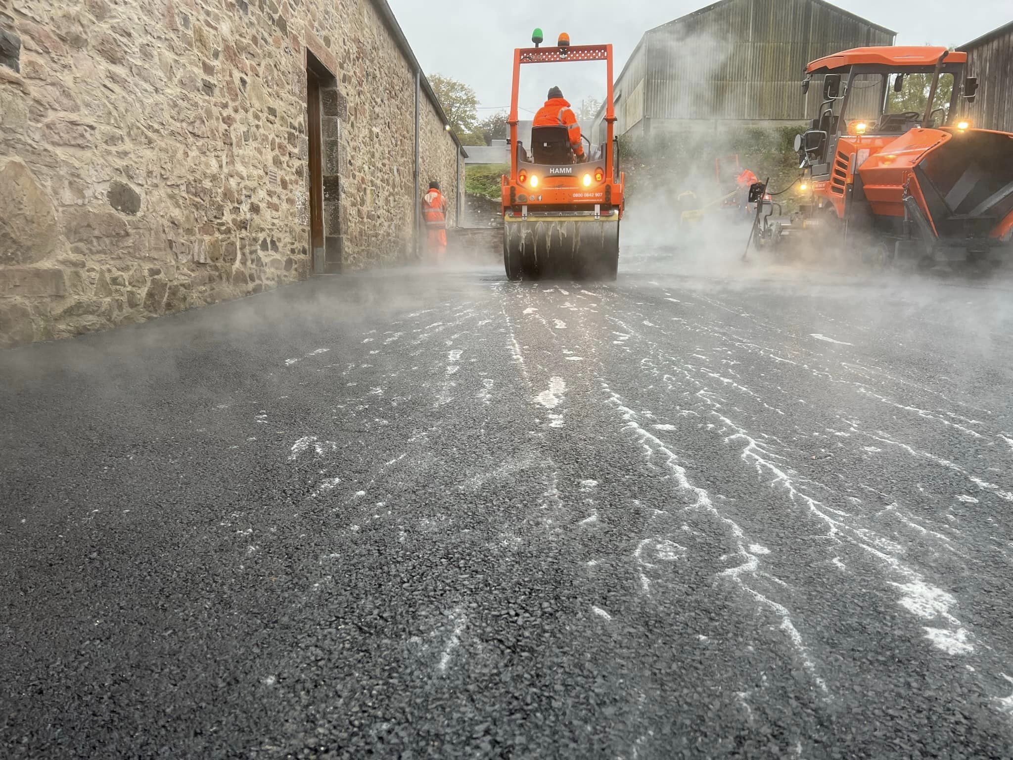 base course tarmac and stone mastic asphalt is then laid, rolled and sealed_1