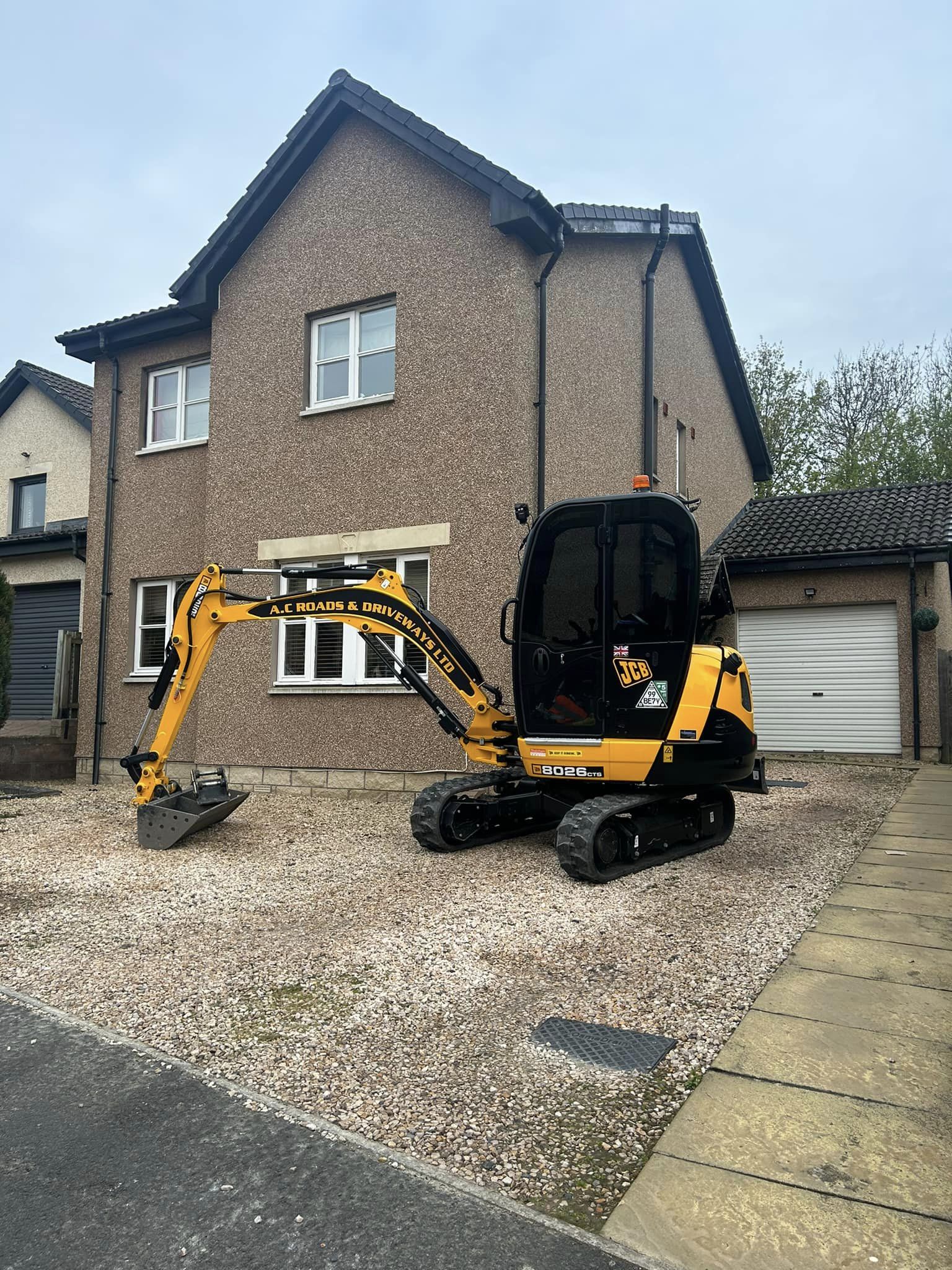 remove old gravel driveway for new tarmac driveway