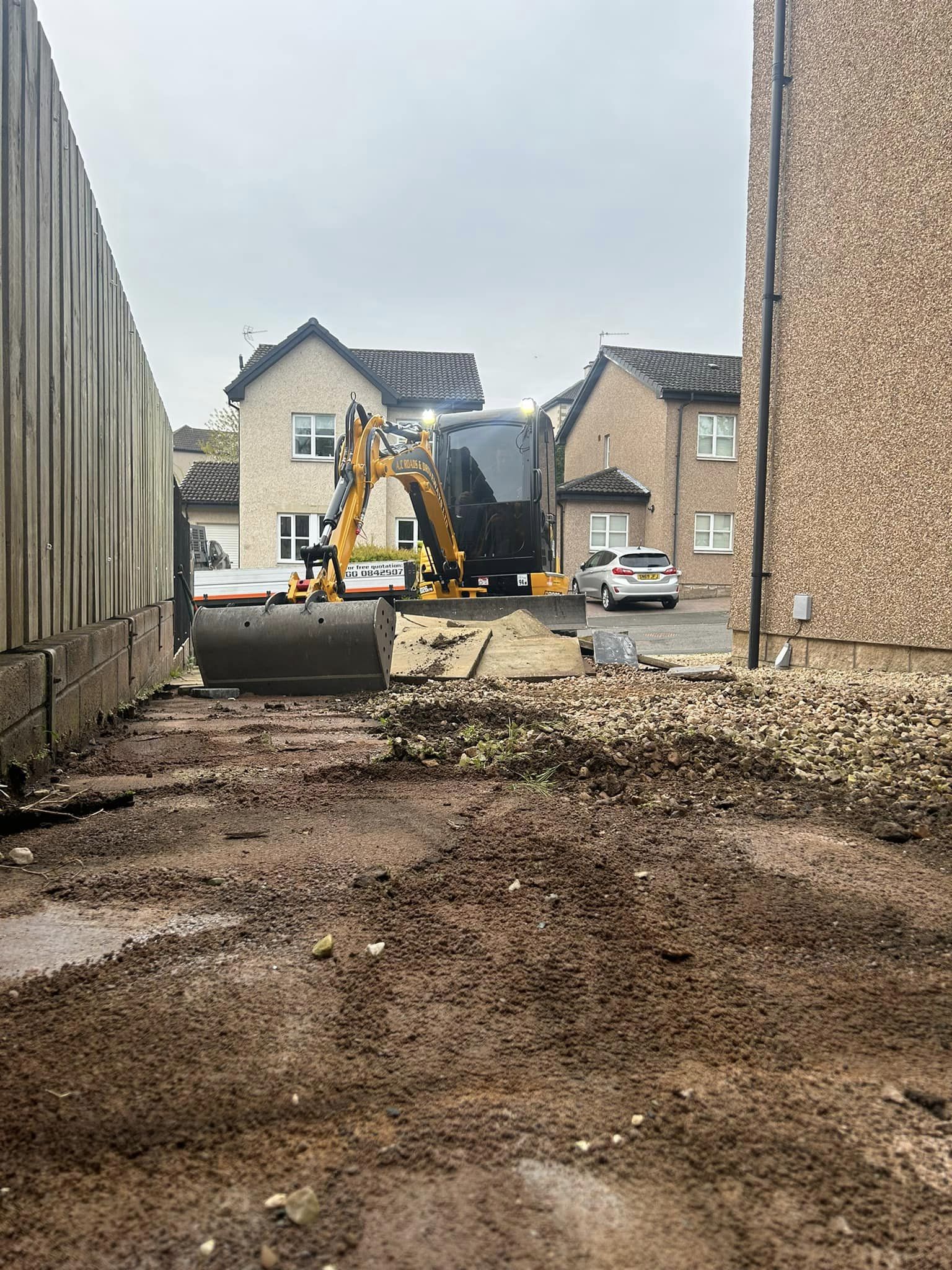 remove old gravel driveway for new tarmac driveway